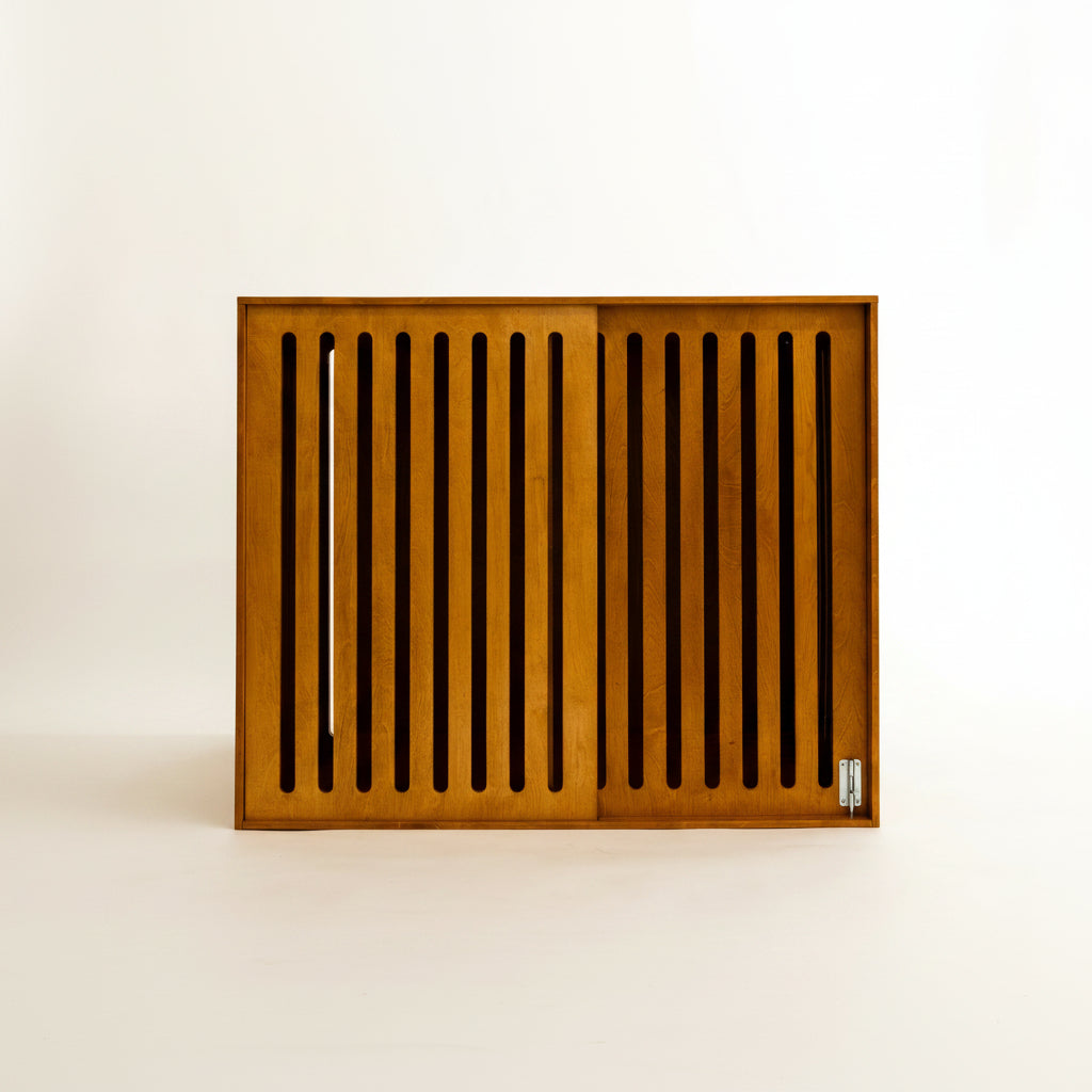 The Den wooden dog crate end table in Oak finish with its sliding front door closed