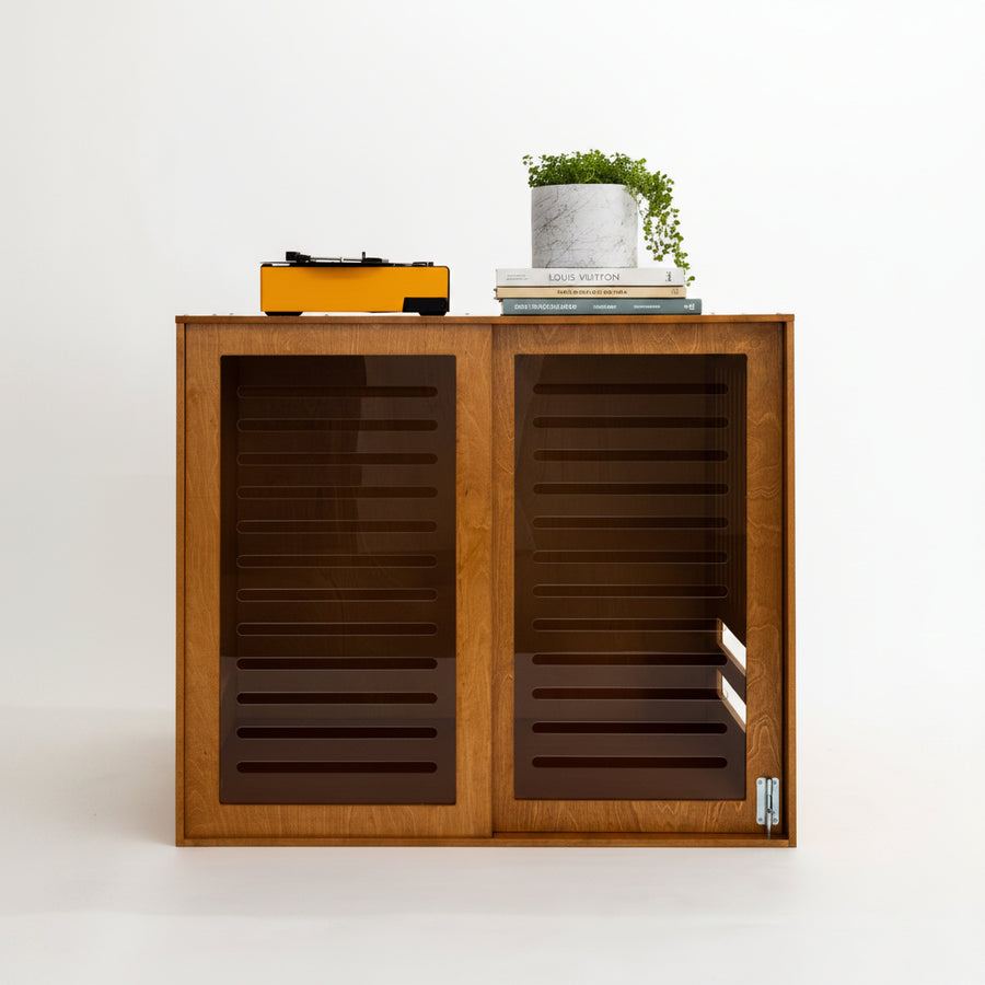 Close-up of the Pad wooden dog crate with a clear acrylic sliding door and a turntable on top